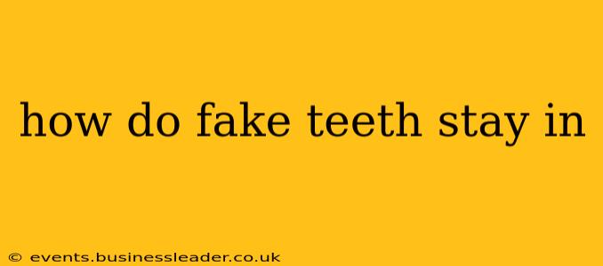 how do fake teeth stay in